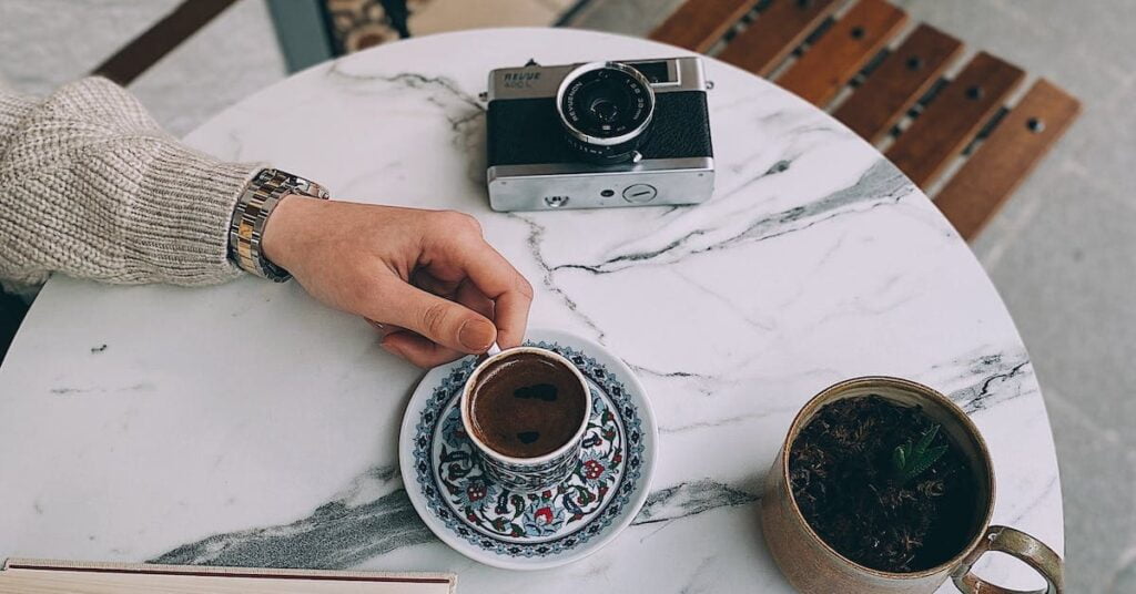 A cup of coffee on a marble coffee table