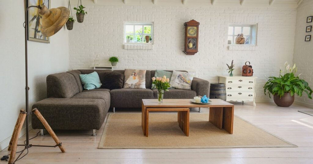 A living room with a designer sofa and a coffee table.