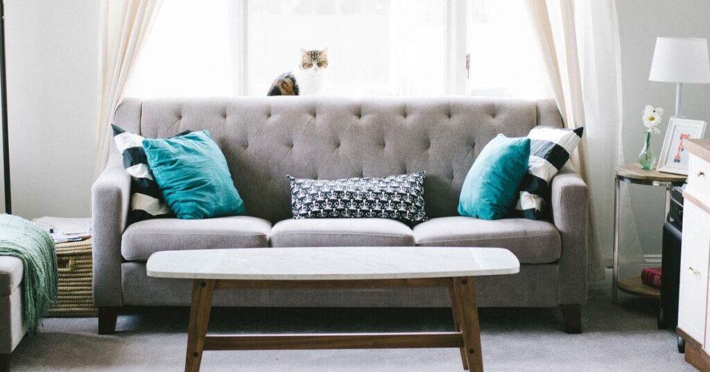 A stylish designer sofa with sleek lines and plush cushions.